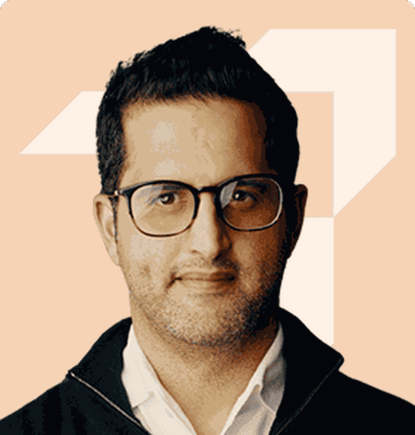 A person wearing glasses and a black jacket

Description automatically generated